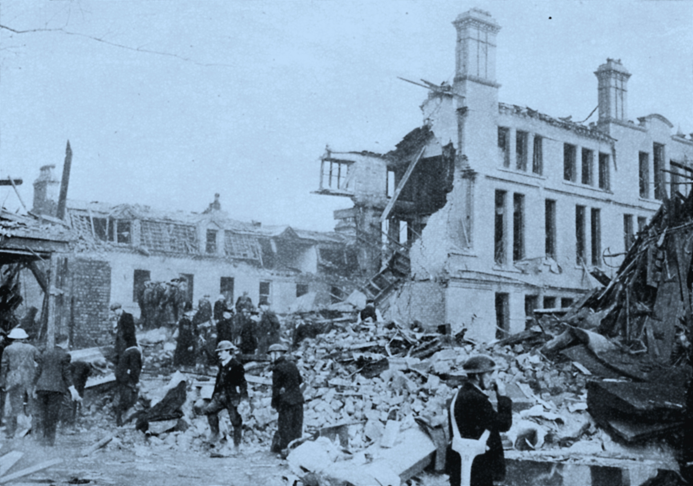 Rescue workers searching through wreckage, England, World War II, 1941